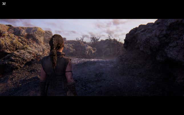 A screenshot shows Senua walking through a rocky environment.